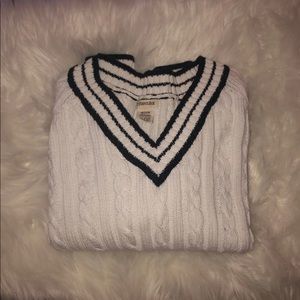 A navy blue and white knit sweater